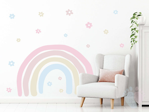 White Nursery Room Featuring Rainbow Wall Stickers And a White Chair By Colorful Mural