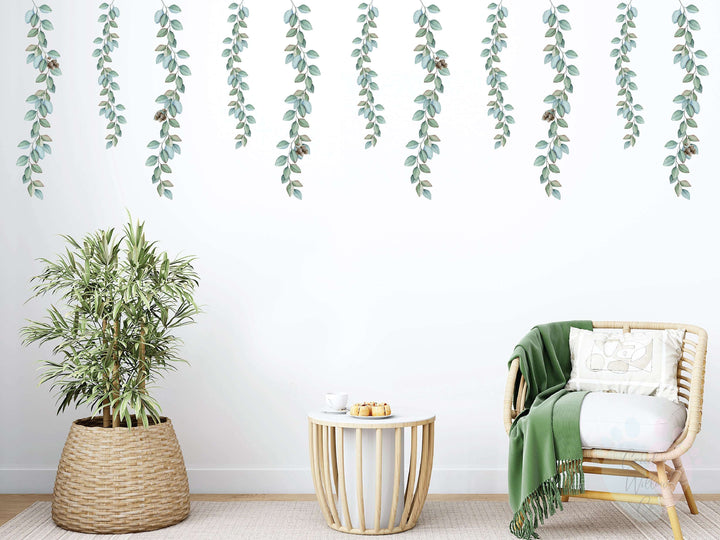 Eucalyptus Vine Wall Stickers With Hanging Vines Over a White Chair