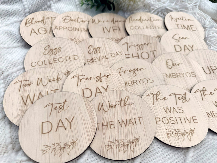 Laser-cut Ivf Milestone Cards Showcasing Wooden Discs With Fertility Treatment Milestones