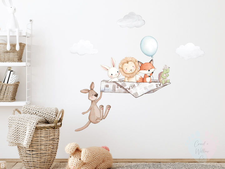 removable fabric vinyl wall decal featuring animals in a paper plane