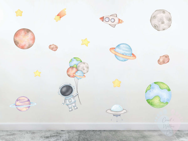 astronaut wall decal with stars planets and rockets in soft blue tones