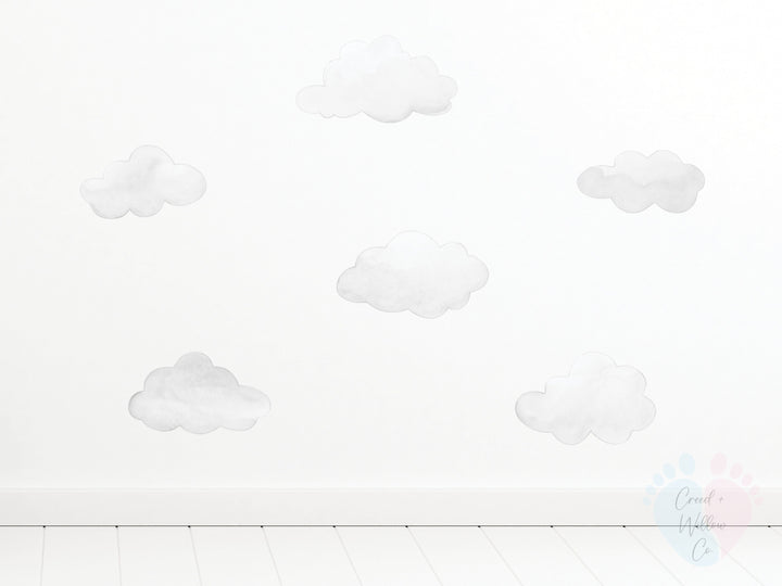 Pack Includes White Cloud Wall Stickers On a Pristine White Wall With Cloud Designs